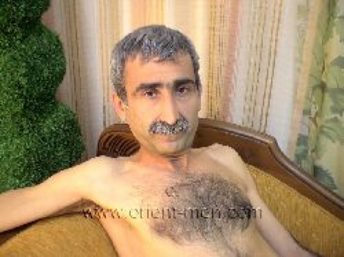 Haluk - a very Hairy Kurdish Man lies naked on an Ottoman. (id407)