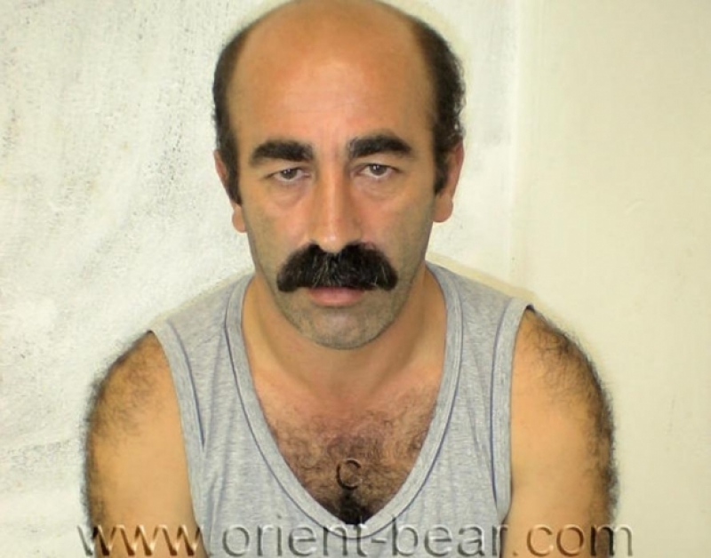 Hueseyin - a very hairy Older Turkish **** in Handcuffs in a Cell strips naked and jerks his very stiff ****. (id126)