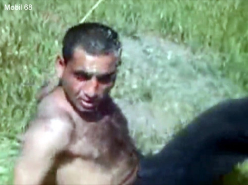 Mobil-68 - a Kurdish Man is stripped naked by his Friends in a Meadow. (id1441)