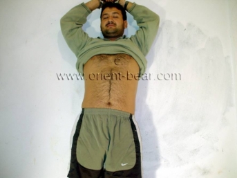 Cengiz - a young Naked Hairy Turk handcuffed as a Prisoner jerks off in his Cell . (id309)