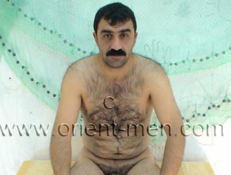 Tufan - a Hairy Kurdish Man in Rubber Boots sits naked on a seat seen in a turkish **** video. (id32)